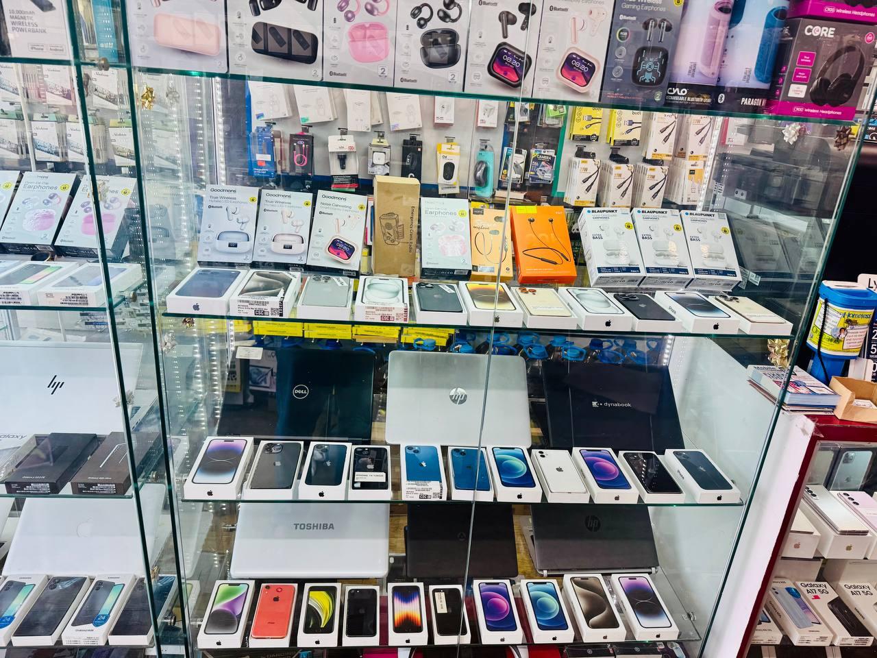 Phones, laptops and accessories in the PHONE LAND display case